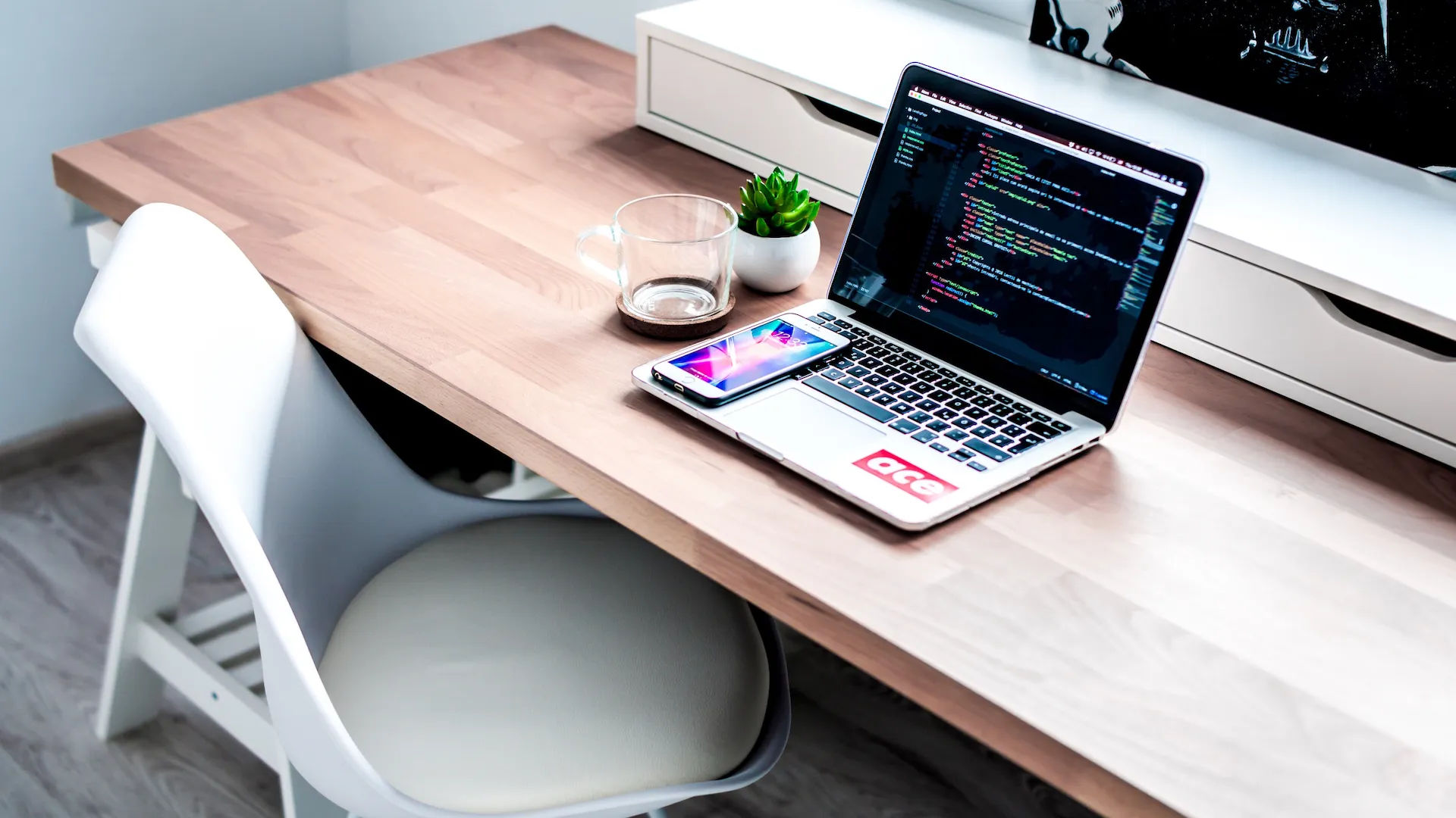 Home office with desk, chair, laptop and phone